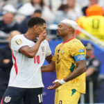 Why Jude Bellingham Avoided a Red Card After Covering His Mouth During a Conversation with Jordan Ayew